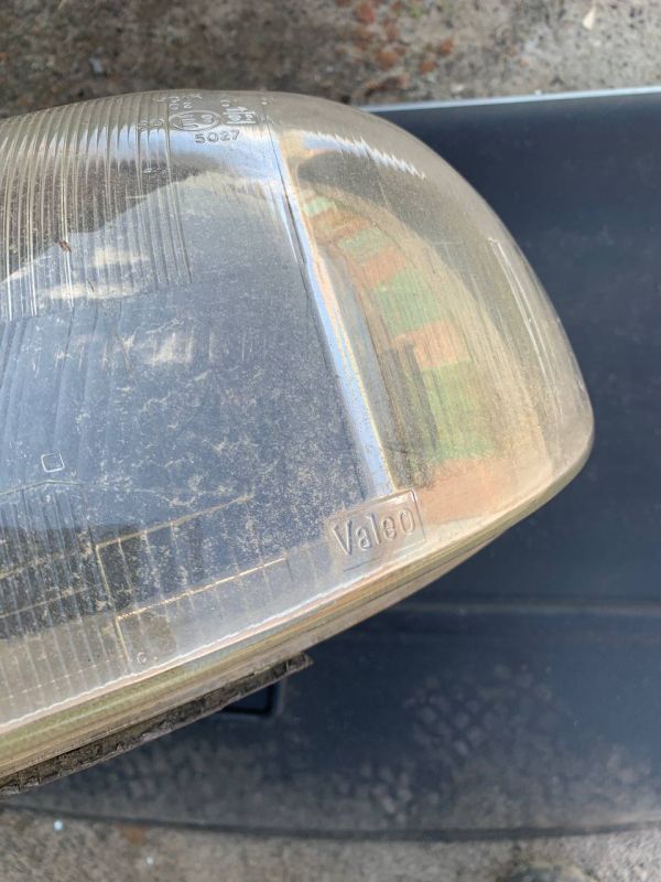 Скло фари переднє ліве Opel Combo